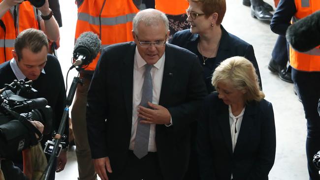 Scott Morrison accompanied by Melissa McIntosh, the candidate for Lindsay, and minister Marise Payne, with business owner Ben Vicary, during a visit to Western Gulf Oil in St Marys in Western Sydney.