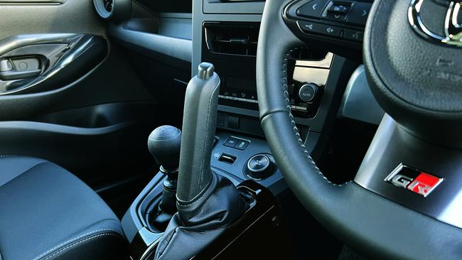 Hardcore models in Japan have a high-mounted, vertical handbrake lever close to the steering wheel.