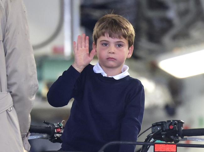 FAIRFORD, ENGLAND - JULY 14: Prince Louis of Wales waves as he sits inside a vehicle on a C17 plane during a visit to the Air Tattoo at RAF Fairford on July 14, 2023 in Fairford, England. The Prince and Princess of Wales have a strong relationship with the RAF, with the Prince having served with the Search and Rescue Force for over three years, based at RAF Valley in Anglesey. The Prince is Honorary Air Commodore of RAF Coningsby and The Princess is Honorary Air Commodore of the Air Cadets. (Photo by Chris Jackson/Getty Images)