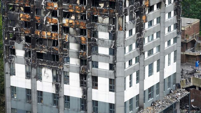 The unburned lower floors with untouched cladding still in place are pictured, with the burnt out upper floors above, at remains of the Grenfell Tower block. Picture: Niklas Halle’n