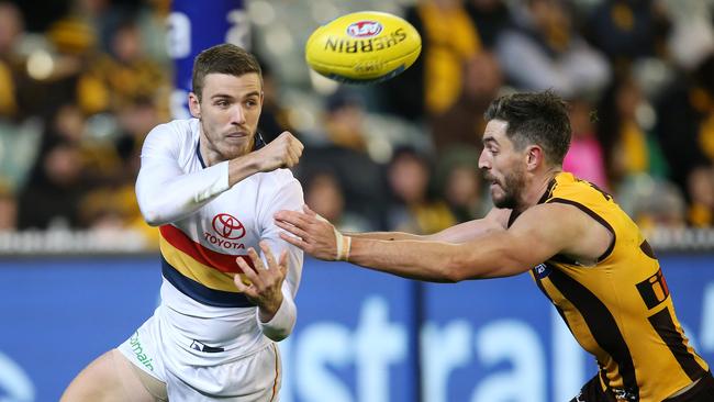 Adelaide's Paul Seedsman clears by hand against Hawthorn in 2018. Picture: Michael Klein