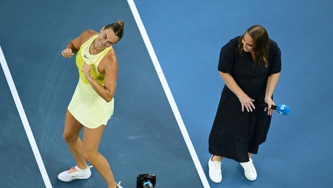Dokic interviewing – and dancing with – Aryna Sabalenka at this year’s Australian Open. (Photo by Hannah Peters/Getty Images)