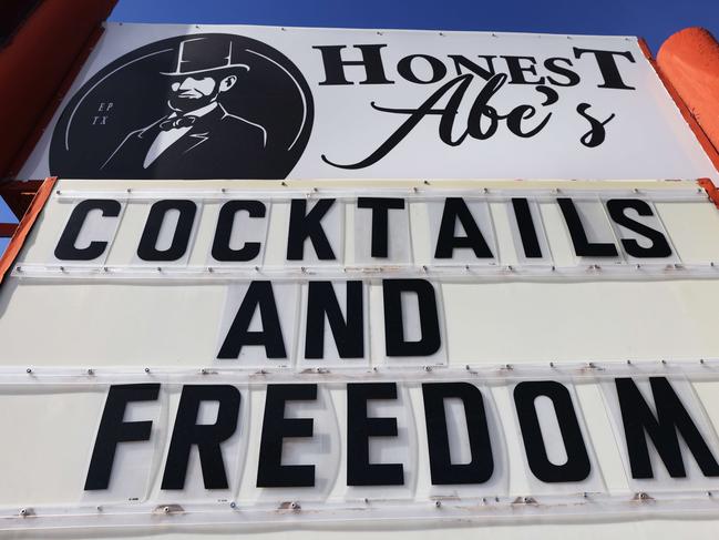 EL PASO, TEXAS - NOVEMBER 22: An indoor bar which is open displays a sign reading 'Cocktails and Freedom' amid a COVID-19 surge in the city on November 22, 2020 in El Paso, Texas. Texas surpassed 20,000 confirmed coronavirus deaths November 16, the second highest in the U.S., with active cases in El Paso now over 35,000 and confirmed COVID-19 deaths at 855. In spite of the recent spike in cases and deaths, Texas Gov. Greg Abbott recently stated to Dallas radio host Mark Davis âWe are not going to have any more lockdowns in the state of Texasâ. A recent analysis by the Washington Post of cell phone data reports that states which reopened their bars had a doubling of cases of COVID-19 just three weeks later.   Mario Tama/Getty Images/AFP == FOR NEWSPAPERS, INTERNET, TELCOS & TELEVISION USE ONLY ==