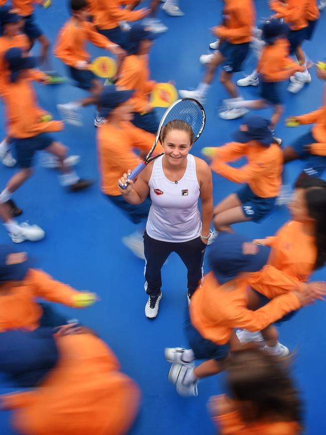 Ashleigh Barty and the Vegemite ball boys and girls. Picture: Tony Gough