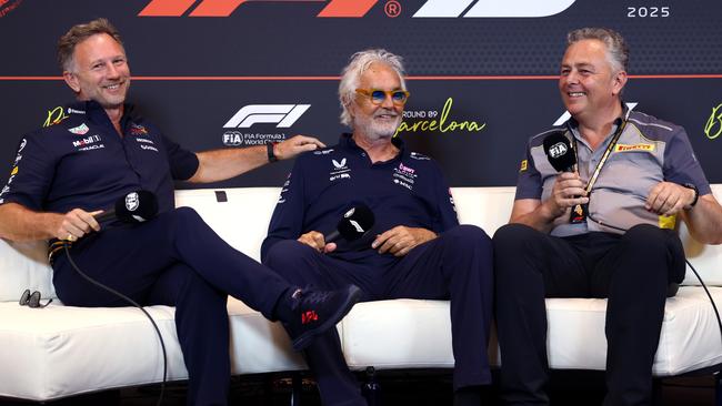 Flavio Briatore (centre) holds court alongside Red Bull boss Christian Horner (left) and Mario Isola (right). Photo by Clive Rose/Getty Images.