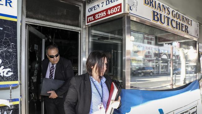 Detectives at Brian's Gormet Butcher on Jetty Road Glenelg 19 August 2017. Police believe a fire there in the early hours of Saturday morning was deliberately lit. Photo: AAP/Mike Burton