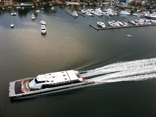 A ferry heads down the Parramatta River near Gladesville.
