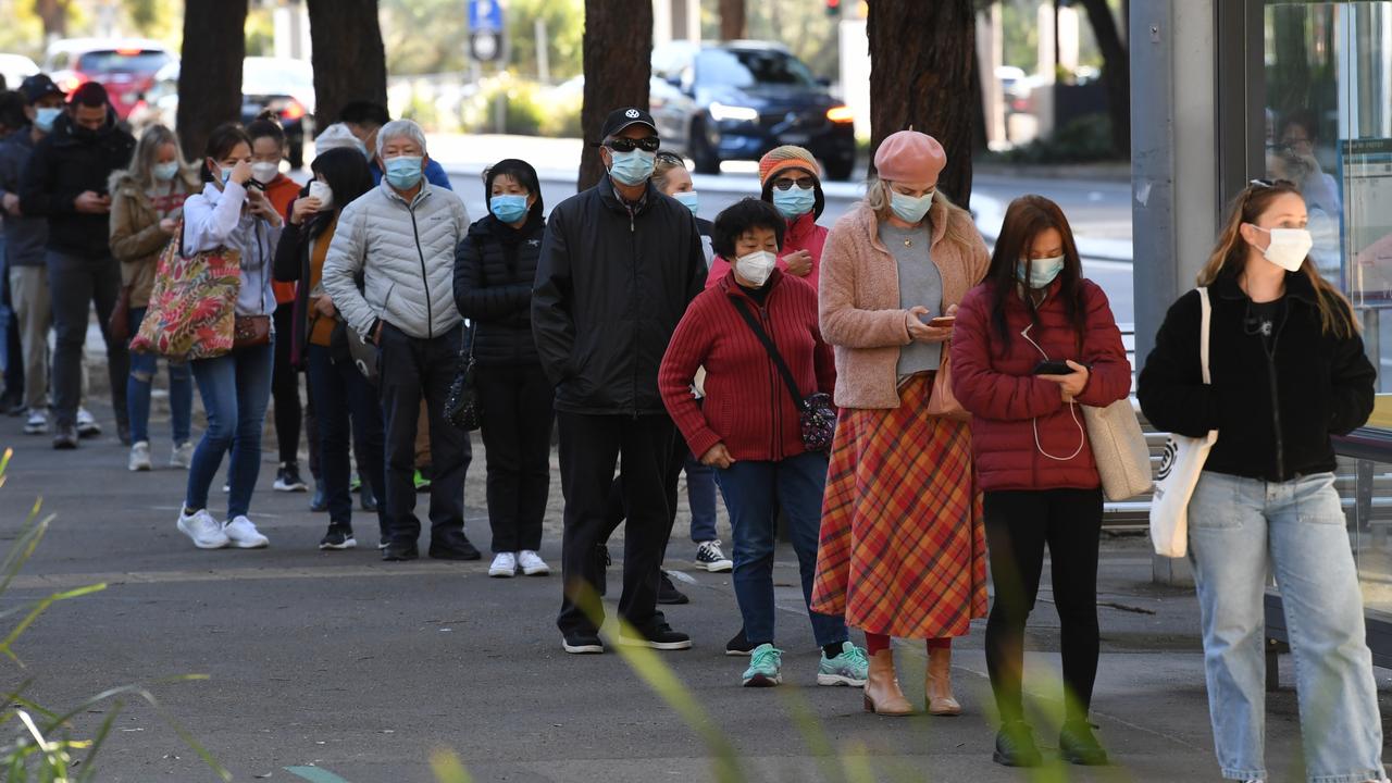 People queue to receive the Covid-19 vaccine at the NSW Health Vaccination Centre at Sydney Olympic Park. Picture: James D Morgan/Getty Images