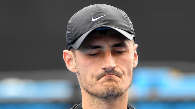 Bernard Tomic of Australia reacts against Lorenzo Sonego of Italy during qualifying round 3 for the Australian Open tennis tournament, Sunday, January 14, 2018. (AAP Image/Julian Smith) NO ARCHIVING, EDITORIAL USE ONLY