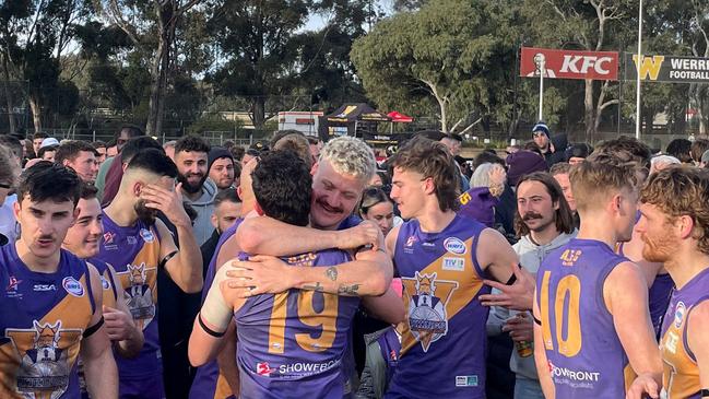Joel Menadue and Luke Whatman embrace.
