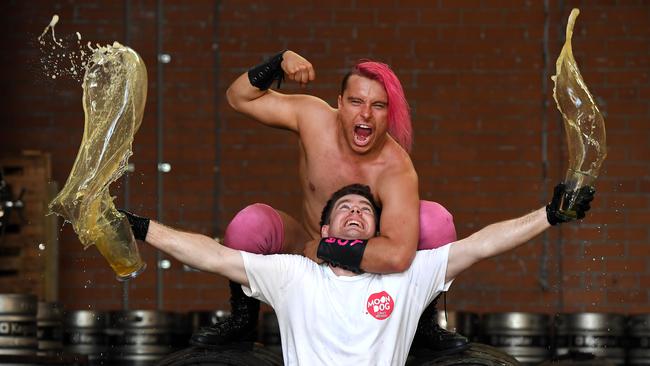 Wrestler ‘Loverboy’ Lochy Hendricks is well on top in the fight against Moon Dog brewer Ben Hall. Picture: Andy Brownbill