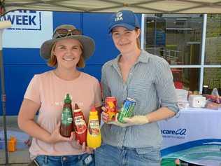 Centacare CQ's Danielle Mitchell and Anna Morris held a susage sizzle Sunday to raise money for their School Savvy project. Picture: Jann Houley