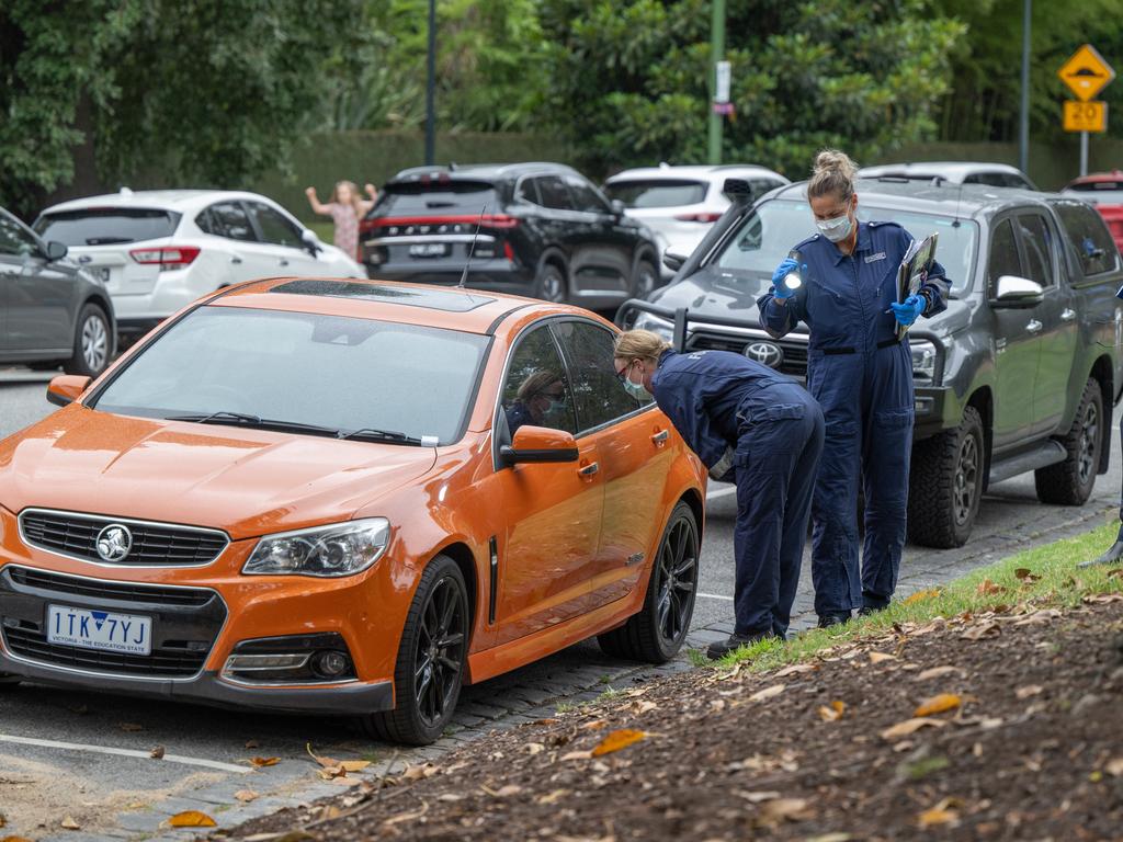 Police and forensic team investigating a vehicle linked to the Chapel Street firebombing early this morning. Picture: Tony Gough