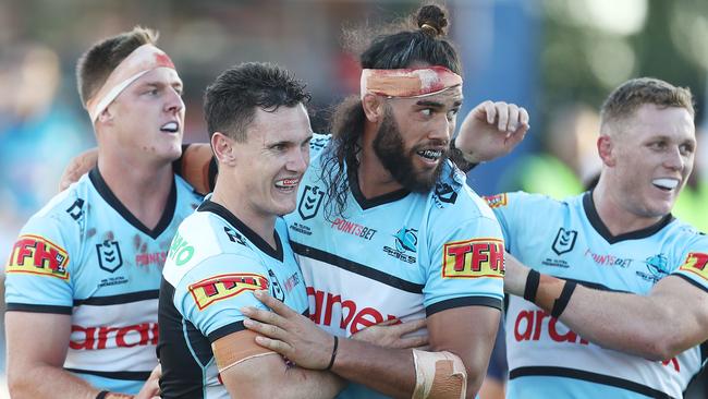 Connor Tracey of the Sharks celebrates scoring a try with teammates. Picture: Mark Metcalfe/Getty Images