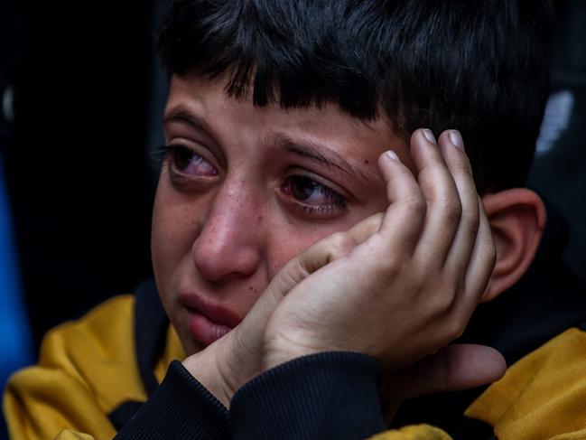 People mourn as they collect the bodies of Palestinians killed in an air strike on December 04, 2023 in Khan Yunis, Gaza. Picture: Ahmad Hasaballah/Getty Images