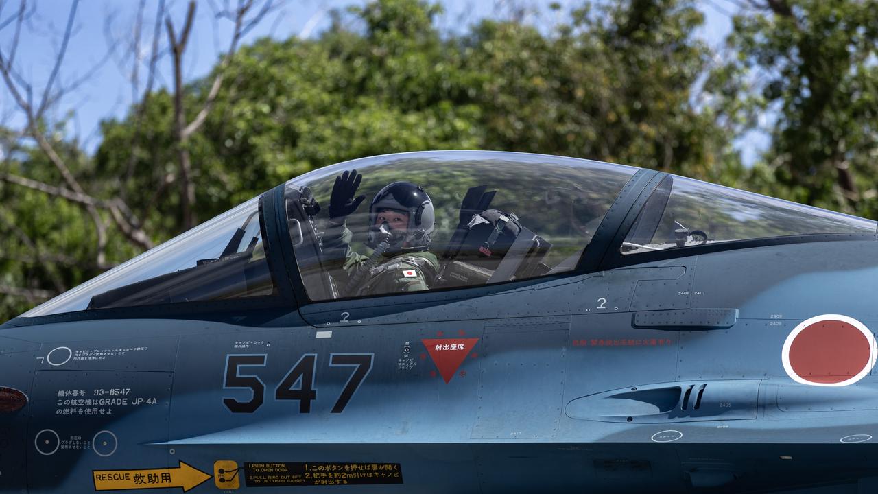 A Japan Air Self-Defense Force F-2 pilot waves as they taxi on a multilateral field training exercise involving the United States Air Force (USAF), Japan Air Self-Defense Force (Koku-Jieitai), and the Royal Australian Air Force (RAAF). Picture: LACW Maddison Scott/Defence