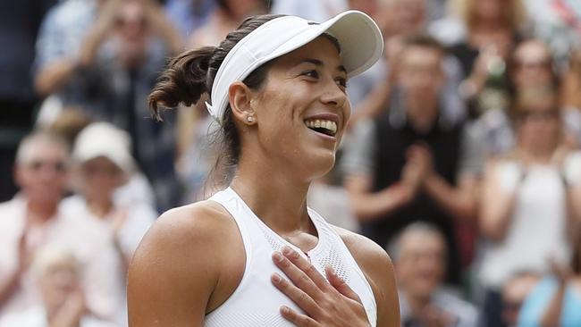 Garbine Muguruza celebrates after beating Magdalena Rybarikova to reach the Wimbledon final.