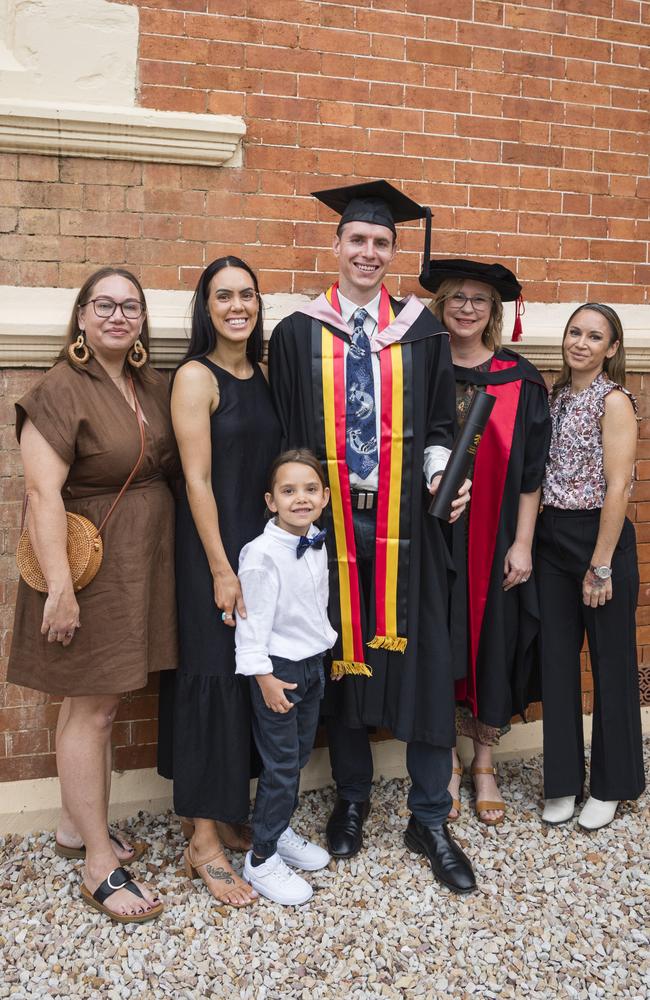 Masters of Psychology (Research) graduate Joshua Waters with family and friends (from left) Kerry Canning, Louarna Waters, Maayali Waters, academic supervisor Renee Desmarchelier and Rachel Waters at a UniSQ graduation ceremony at Empire Theatres, Wednesday, February 14, 2024. Picture: Kevin Farmer