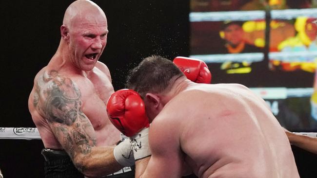 Barry Hall lands an uppercut during Friday night’s Code War fight against Paul Gallen. Picture: Michael Dodge.