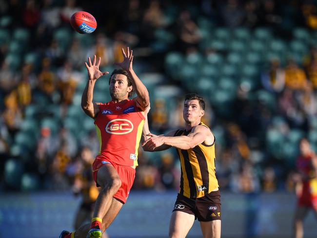 Lachie Weller of the Suns (left) and Jaeger OÕMeara of the Hawks contest during the Round 14 AFL match between the Hawthorn Hawks and the Gold Coast Suns at the University of Tasmania Stadium in Launceston, Saturday, June 23, 2018. Picture: AAP Image, Julian Smith.