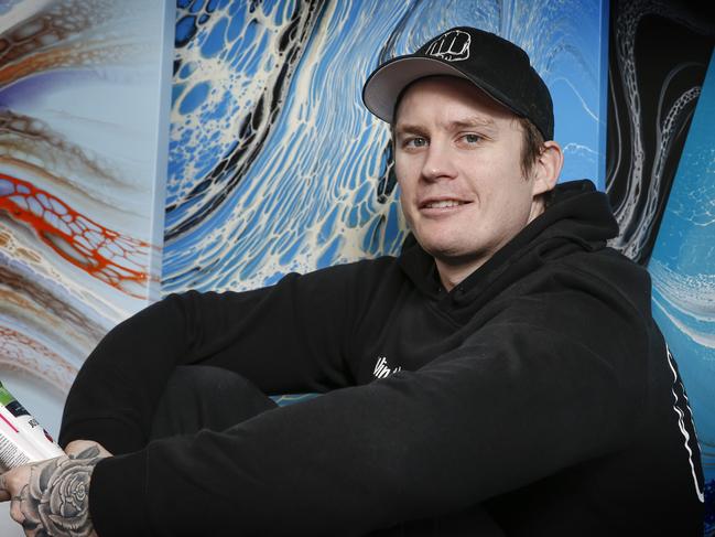 Weekend Cover story Dayne Beams former Collingwood and Brisbane Lions player. Dayne surrounded by some of his works art at his Health of Mind Art studio.  Picture: David Caird