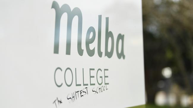 Graffiti vandals tagged signs at Melba College's abandoned Croydon campus. Picture: James Ross