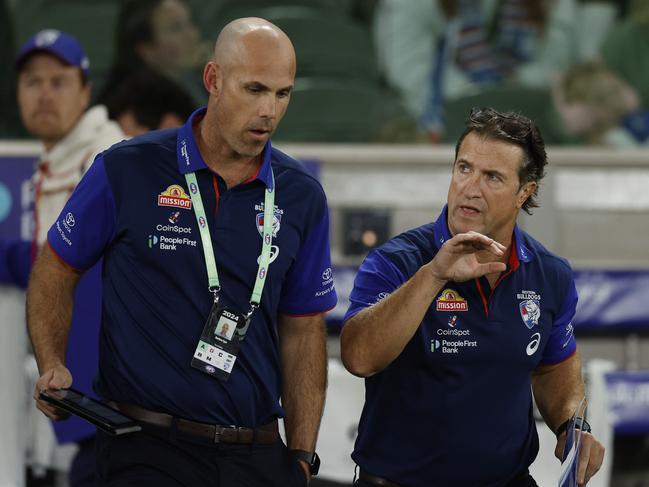 MELBOURNE , AUSTRALIA. May 4, 2024.  AFL Round 8. . Western Bulldogs vs Hawthorn at Marvel Stadium.   Luke Beveridge , Senior Coach of the Bulldogs with Matthew Egan at 3 qtr time   . Pic: Michael Klein