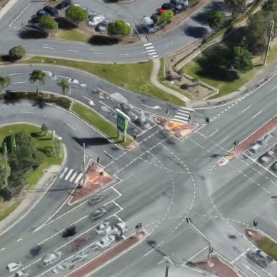 Oxley Dr at Biggera Waters, outside busy Harbour Town shopping centre.