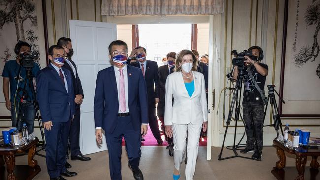 Pelosi arrives at the Legislative Yuan, Taiwan's house of parliament, with Tsai Chi-Chang, front left, Vice President of the Legislative Yuan.