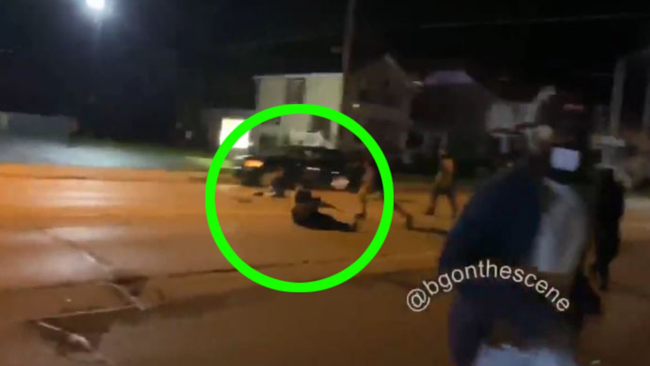 A man on the ground, just moments before he apparently shoots at another person. Picture: Twitter