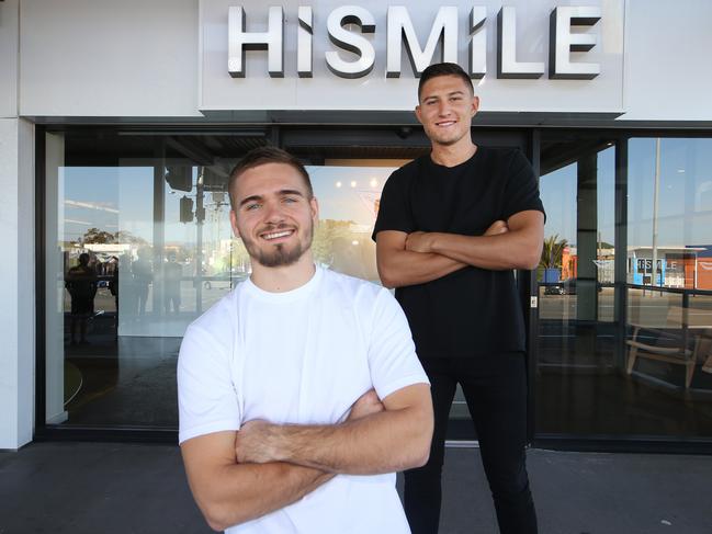 Gold Coast millionaire businessmen Alex Tomic (front) and Nik Mirkovic at their Mermaid Beach office. Picture Glenn Hampson