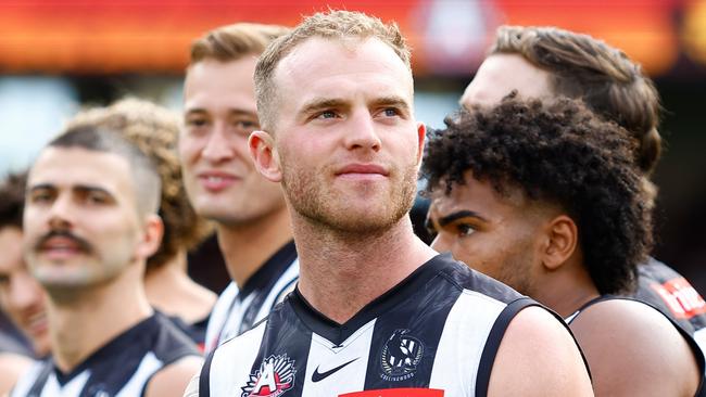 MELBOURNE, AUSTRALIA - APRIL 25: Tom Mitchell of the Magpies looks on during the Anzac Day observance ceremony during the 2023 AFL Round 06 match between the Collingwood Magpies and the Essendon Bombers at the Melbourne Cricket Ground on April 25, 2023 in Melbourne, Australia. (Photo by Dylan Burns/AFL Photos via Getty Images)