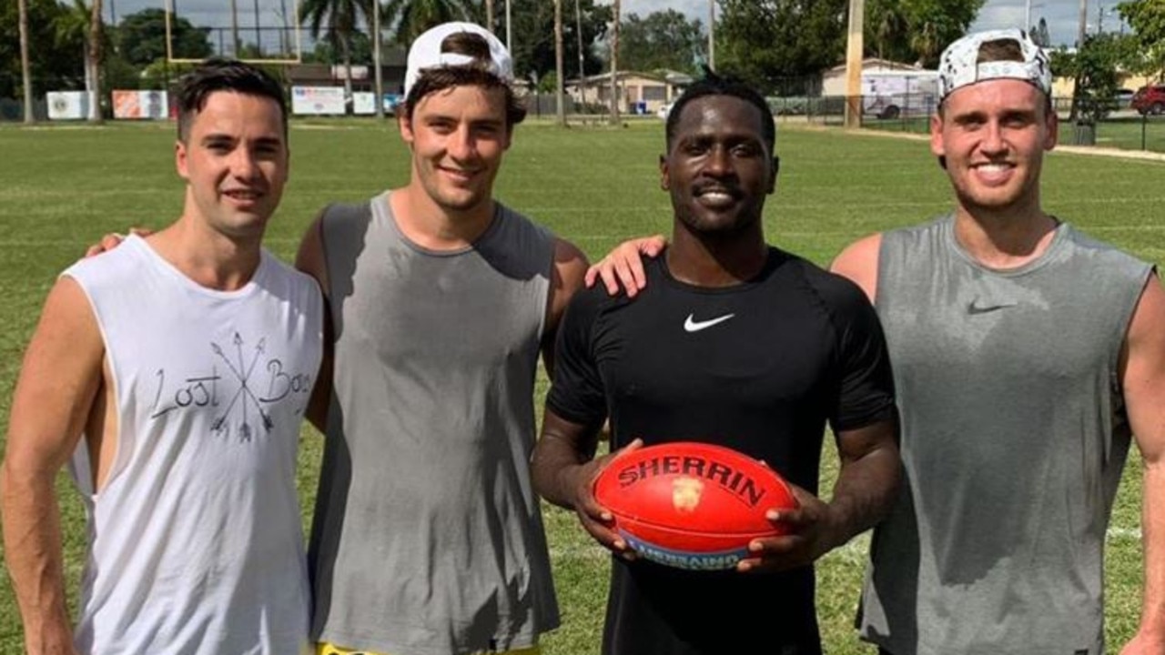 Antonio Brown with Bulldogs duo Josh Dunkley and Hayden Crozier.