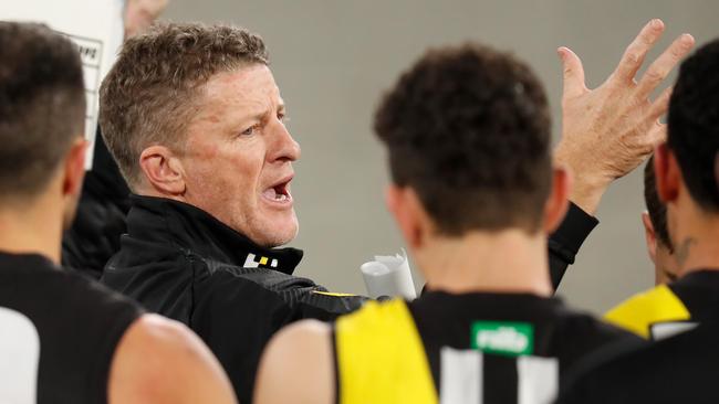 MELBOURNE, AUSTRALIA - JUNE 11: Damien Hardwick, Senior Coach of the Tigers addresses his players during the 2020 AFL Round 02 match between the Collingwood Magpies and the Richmond Tigers at the Melbourne Cricket Ground on June 11, 2020 in Melbourne, Australia. (Photo by Michael Willson/AFL Photos via Getty Images)