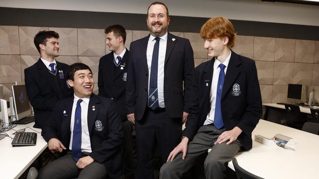 Students (left to right) Dusan Cavric, Alexander Nguyen, Ryan Macdonald and Jack Wall with their teacher Brenden Davidson, who is inspiring students with his passion for technology. Picture: Richard Dobson