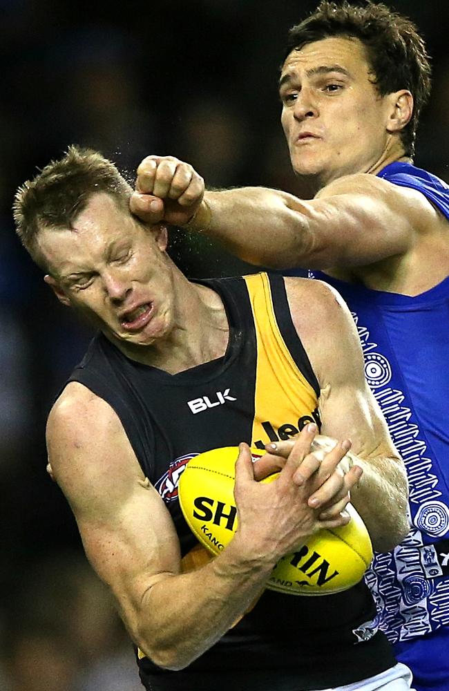 Tiger Jack Riewoldt cops one from Kangaroo Scott Thompson Picture: Wayne Ludbey