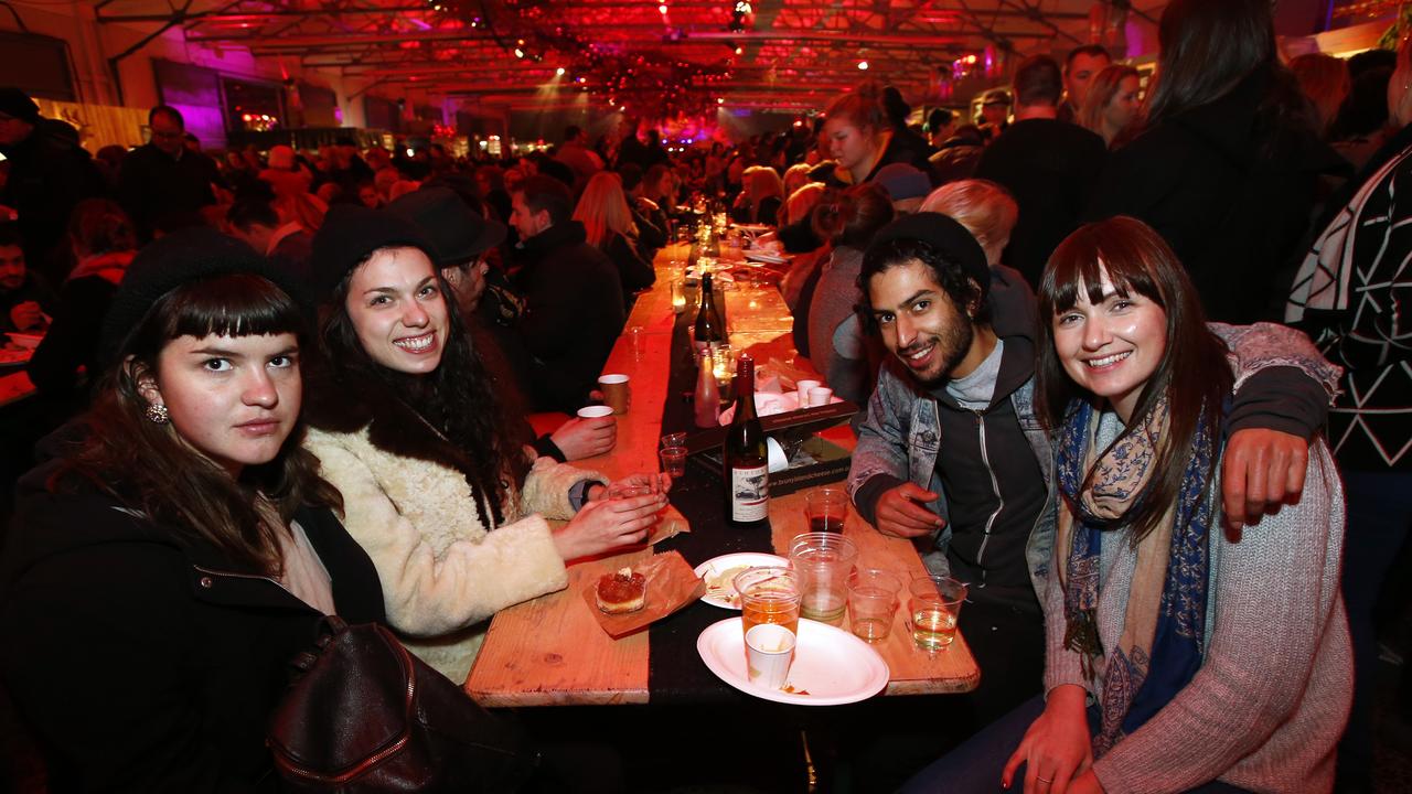 Dark Mofo Winter Feast Friday. Eva Quinn-Walters, Gussie Vinall-Richardson, Zev Tropp and Jess Bicknell, all of Melbourne, inside the Princes Wharf shed.