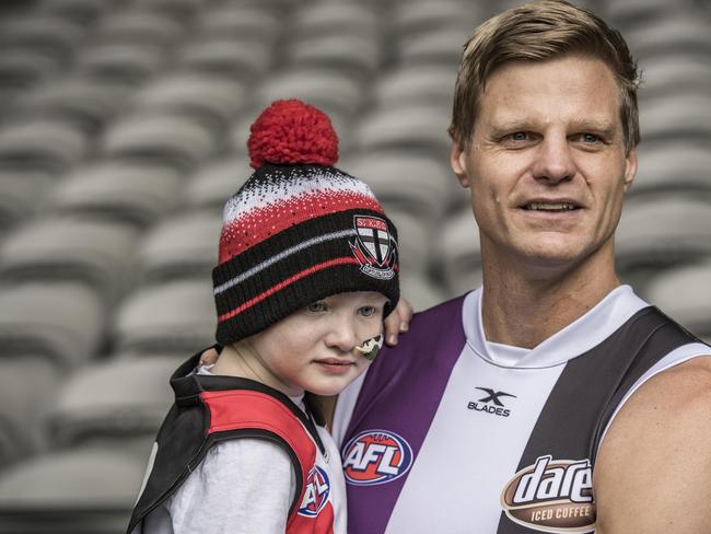 Nick Riewoldt with Elliott Vanderland, who will run through the banner at Maddie's Match on Saturday night. Picture: Jason Edwards