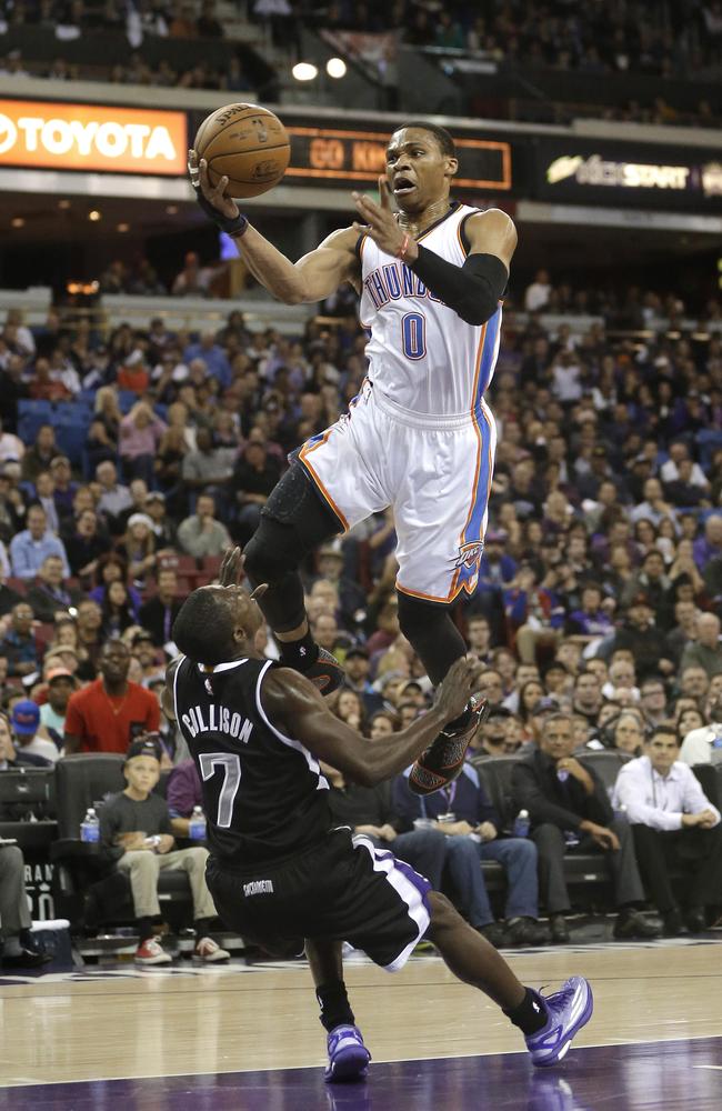 Oklahoma City Thunder guard Russell Westbrook, is fouled by Sacramento Kings guard Darren Collison.