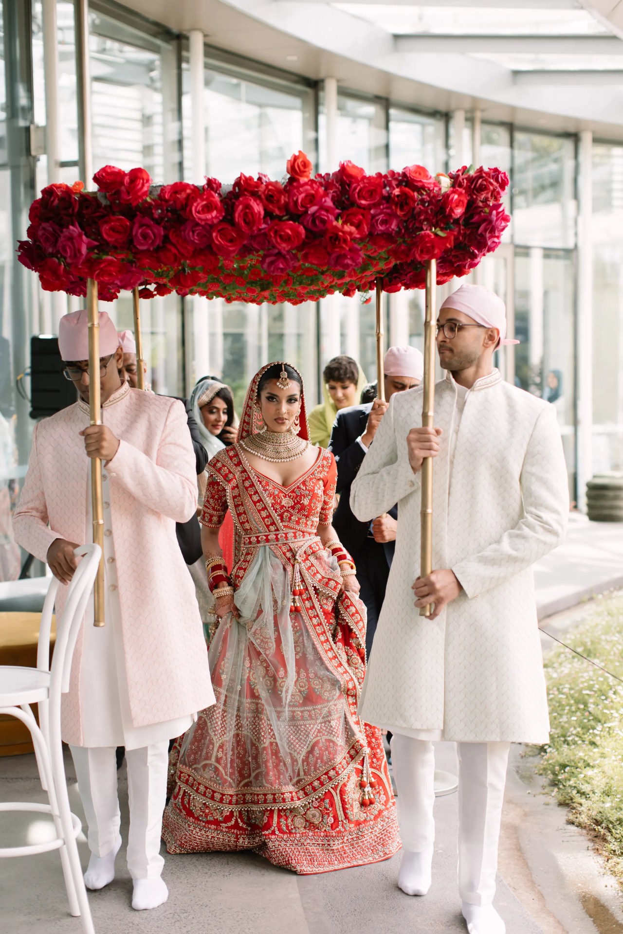 <p><i>Image credit: Jimmy Raper. From <a href="https://www.vogue.com.au/brides/weddings/how-rowi-singh-got-ready-for-her-wedding-rhinestones-braids-and-bold-colours-included/image-gallery/ba680a69969824d325bd4c6fa252ecf7" target="_blank" rel="noopener">How Rowi Singh got ready for her wedding, rhinestones, braids and bold colours included</a></i></p><h2>Rowi Singh in Abhishekh</h2><p>For her wedding in the Botanic Gardens, make-up artist Rowi Singh chose crimson. &ldquo;There was a serene peacefulness to the ceremony&mdash;it almost felt like the frequency of the greenhouse changed as I made my entrance.&rdquo;</p>