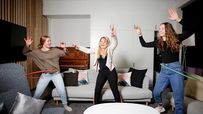 Students Charlie Noble (left) and Olivia King (right) with boarding house assistant Liesa Williams. Picture: Nicole Cleary