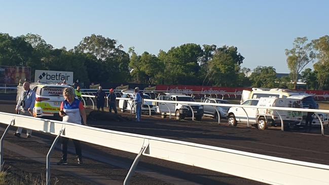 Three jockeys are in hospital and a horse has died after a heavy fall at the Darwin Turf Club track this afternoon. Picture: Supplied