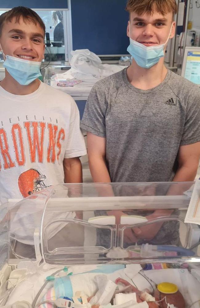 Levi with his brothers Luke and Dion during his stay in the NICU. Picture: Supplied