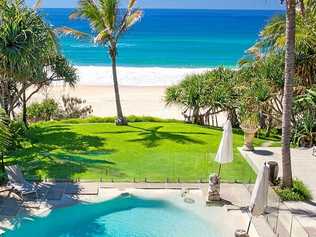 The property overlooks Sunshine Beach, as the backyard lawn meets the sand.