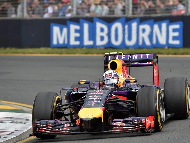 Red Bull driver Daniel Ricciardo of Australia races through a corner past the crowd during a practice session for the Formula One Australian Grand Prix in Melbourne. Picture: AFP/Paul Crock
