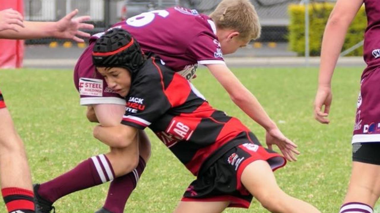 Brock Taylor makes a tackle for Valleys Roosters.