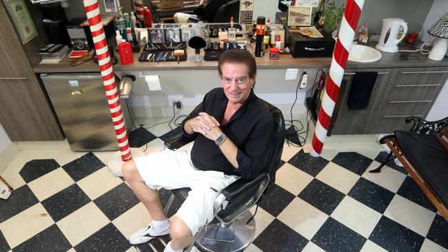 Paul Musson used to be in a band and he sang for both Malcom Fraser and Gough Whitlam. Photo of him at his business on Chevron Island which is called Paul Musson Barber Shoppe. Photo by Richard Gosling