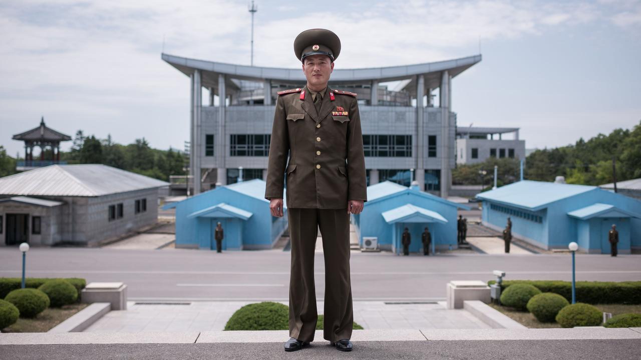 In a photo taken on June 2, 2017 Korean People's Army soldier 'Lieutenant Kim' poses for a portrait before the military demarcation line on the North Korean side of the Joint Security Area (JSA) with the Demilitarized Zone (DMZ) separating North and South Korea. Picture: Ed Jones/AFP