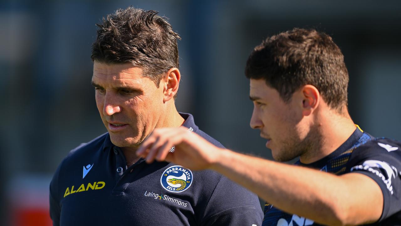 Coach Trent Barrett and Mitchell Moses.