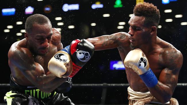 Jermell Charlo punches Charles Hatley during their WBC junior middleweight title bout.